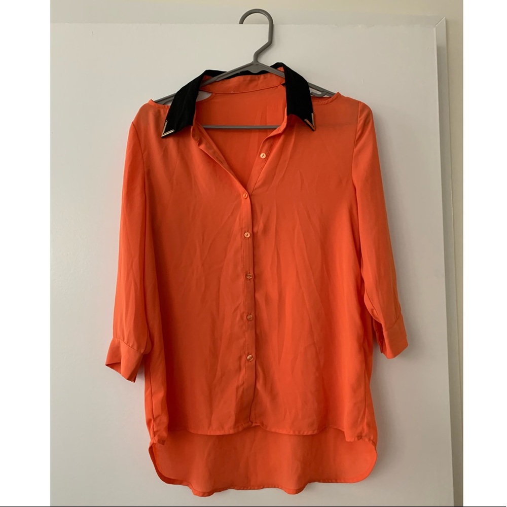 Bright orange and black blouse
